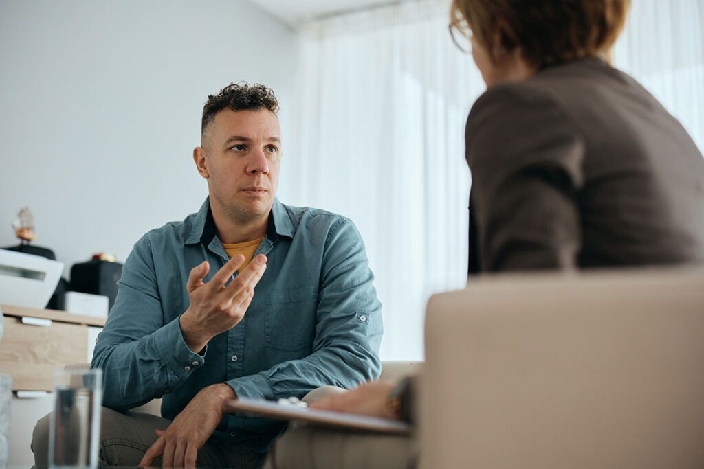 man speaking to therapist about his depression