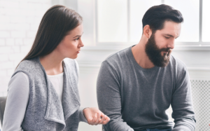 a man and women sit near each other and discuss what a fawn response is